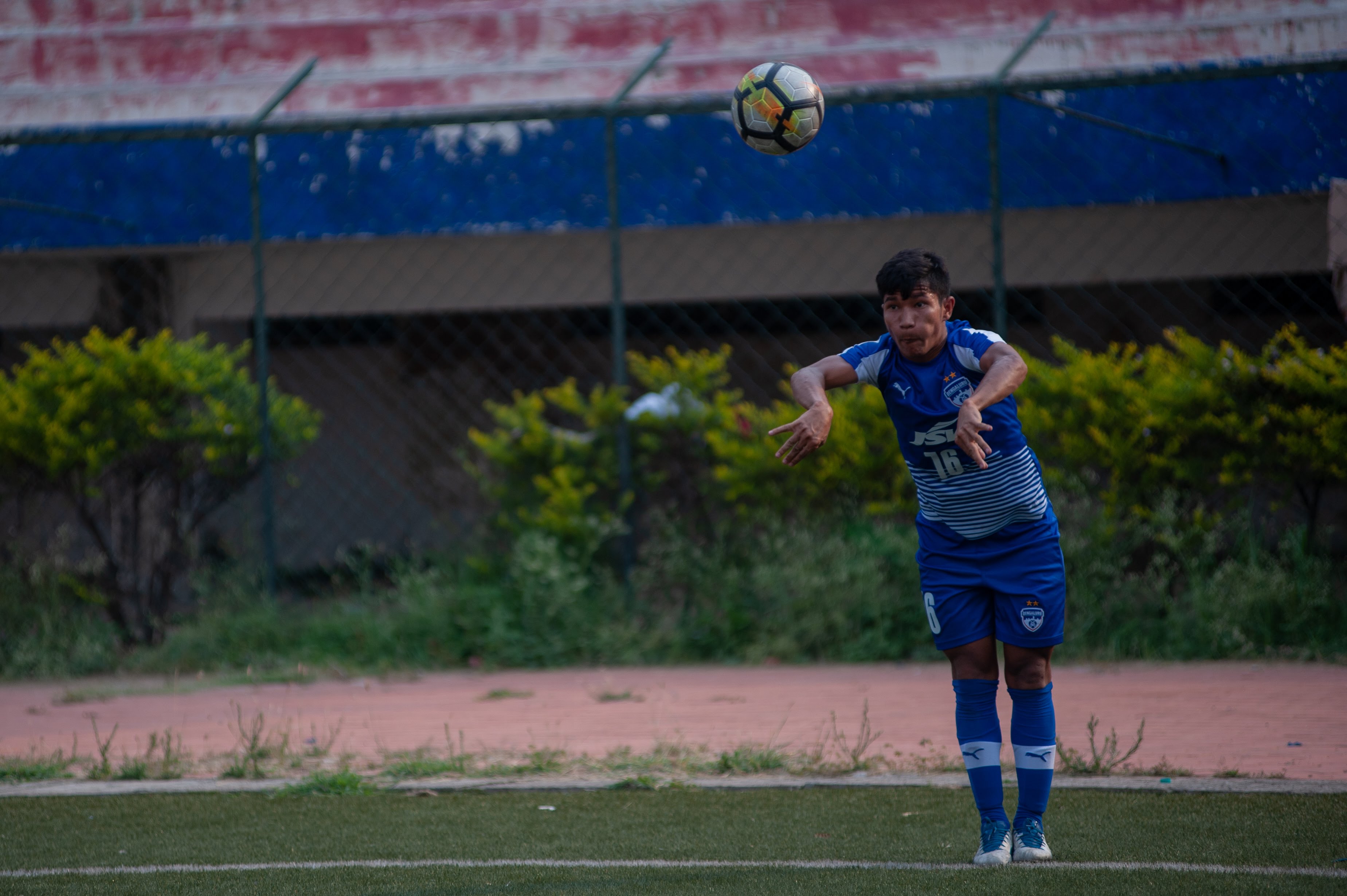 A Bengaluru FC players takes a quick throw in