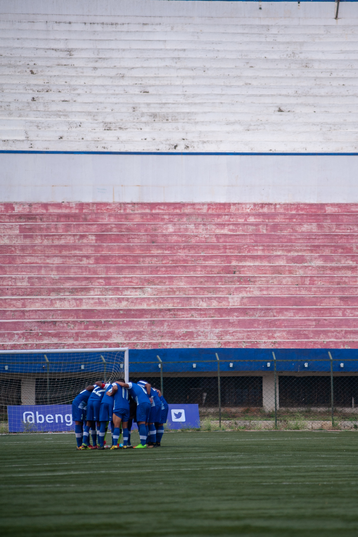 A long shot of the Bengaluru FC B team in a huddle before the start of the second half.