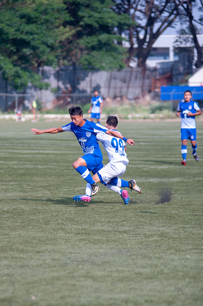 BFC B's Roshan Singh is tackled outside the D by Chennaiyin FC's defender.