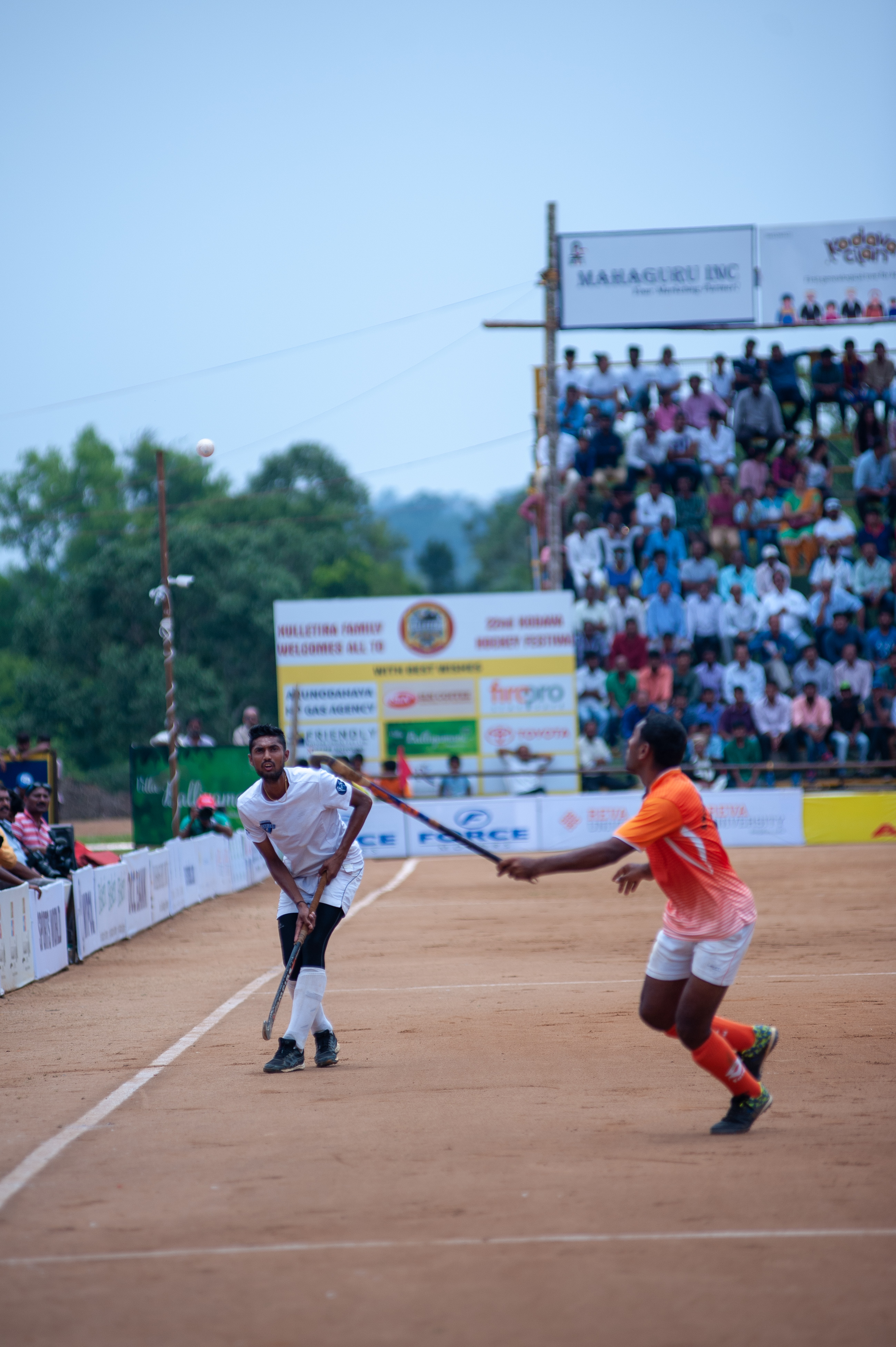 Sonu, a player with the Chendanda family, is seen flicking the ball over the head of an Anjaparvanda midfielder. 